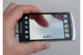 Sony Ericsson Xperia Arc camera viewfinder. Here, photo mode is active. The settings row to the left and gallery to the right can be hidden by dragging it out of the screen